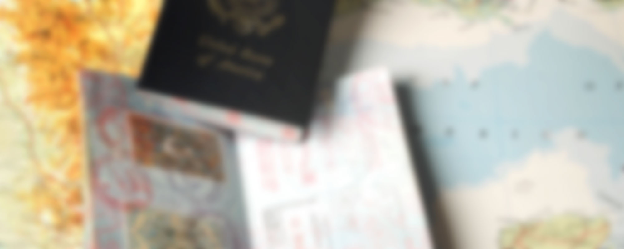 A blurry photo of passports sitting on a map